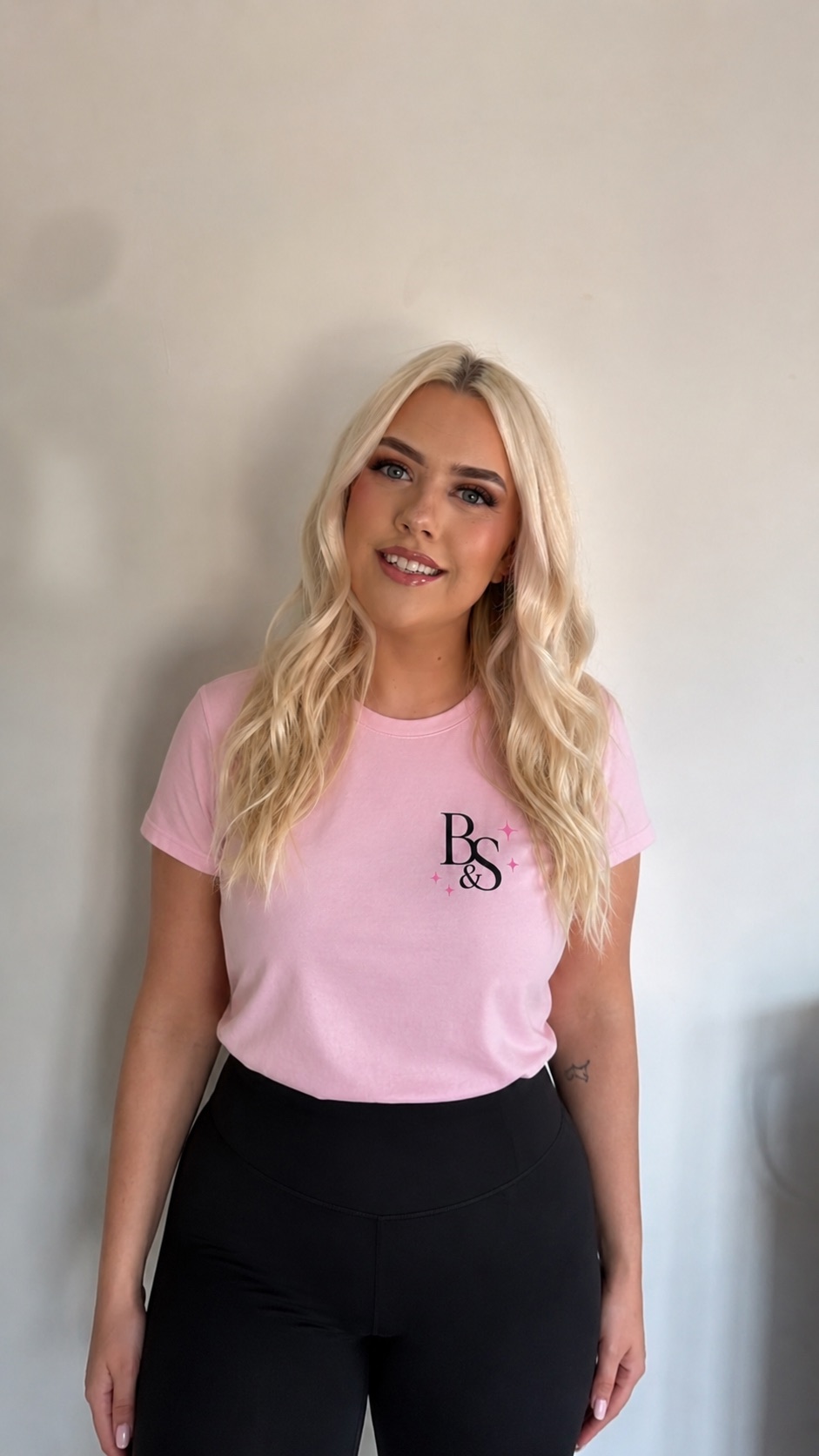 Aimée, founder of Blush & Sparkle, in a Blush & Sparkle t-shirt.